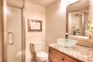 Interior shot of a bathroom with custom countertops and layout