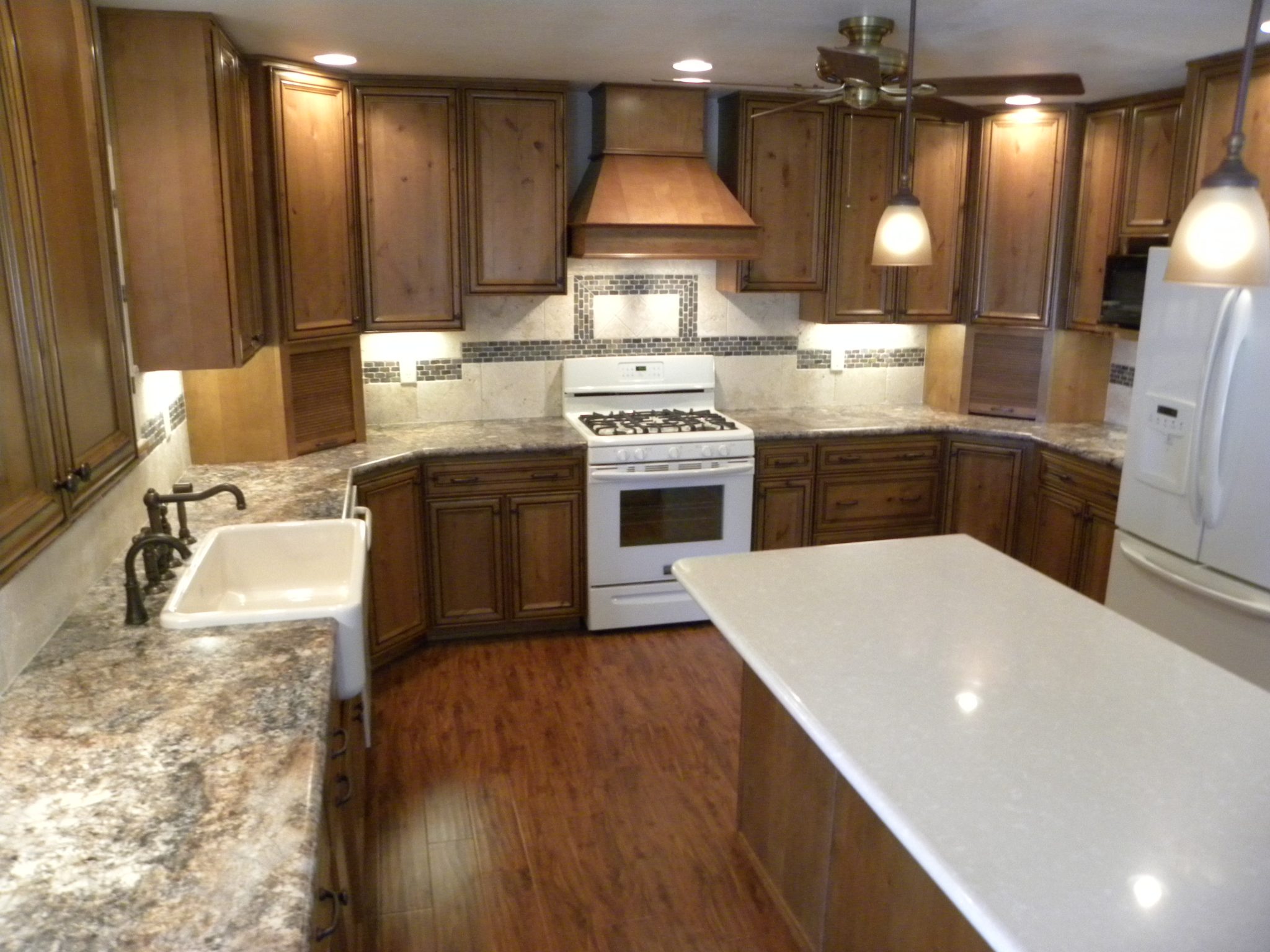 Newly remodeled custom kitchen with wooden cabinets and granite countertops
