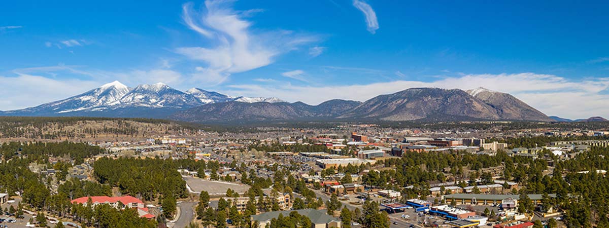 Aerial View of Flagstaff and Snow On Mountaintops