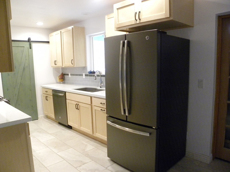 Flagstaff Kitchen Remodel with Sliding Pantry Door & Black Appliances