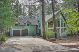 Luxury Home in Flagstaff Woods Green with Brown Trim Front View