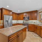Traditional Style Kitchen Cabinetry with golden brown finish
