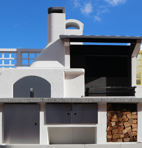 outdoor kitchen with wood-fired oven and grill