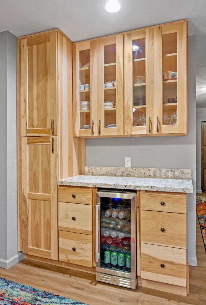 kitchen with cherry wood cabinets and a mini fridge