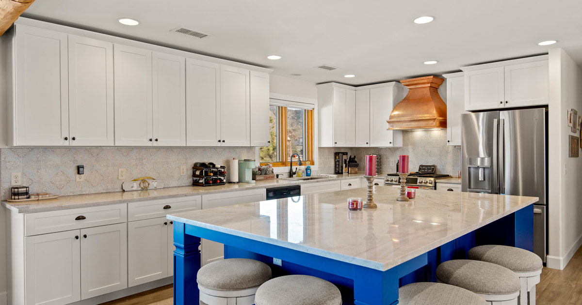 Bold contrast colors utilizing bright blue in kitchen redesign