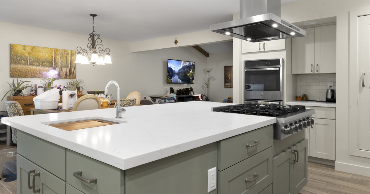 White counter with undermount sink on large island