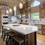 Cabin-style kitchen remodel with wood finish cabinets and large island