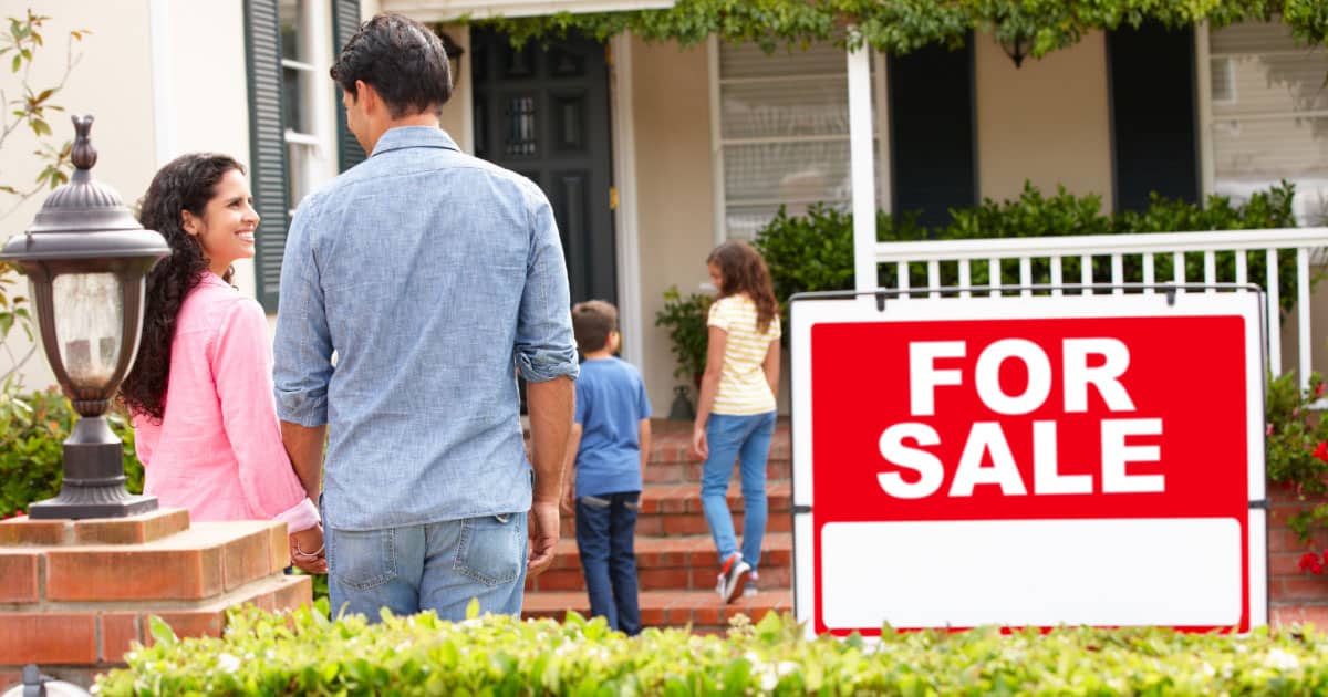 Family walking into a home for sale
