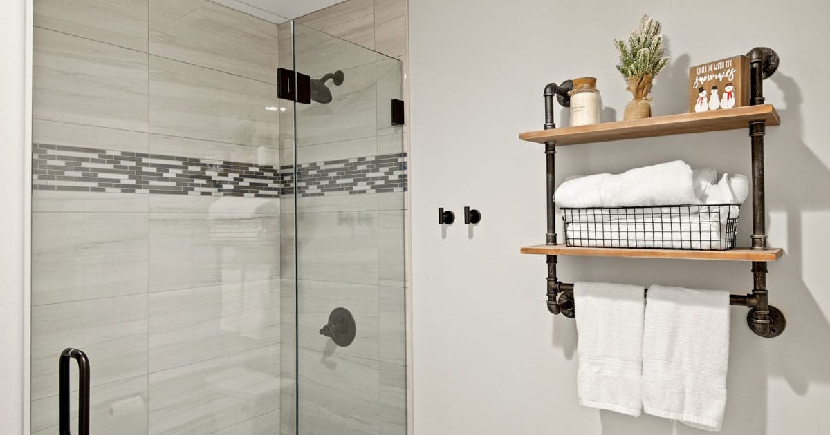Industrial finish bathroom with wrought iron finish shelving