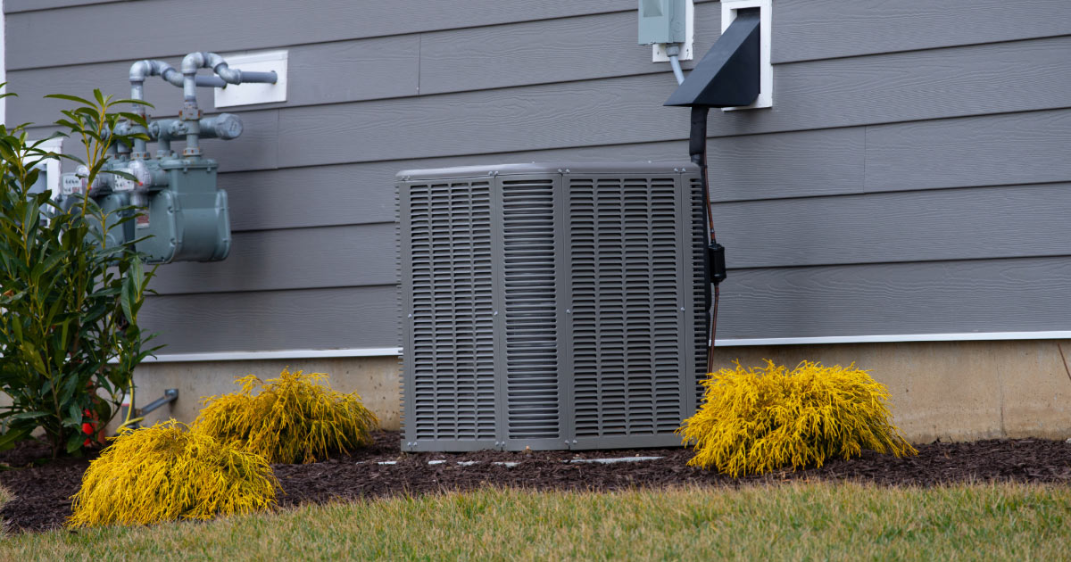 Newer house with air conditioning unit installed on the side