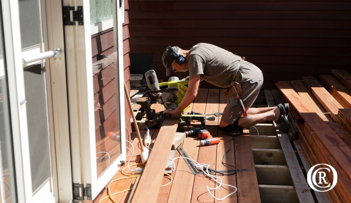 A worker building a deck in Flagstaff Arizona