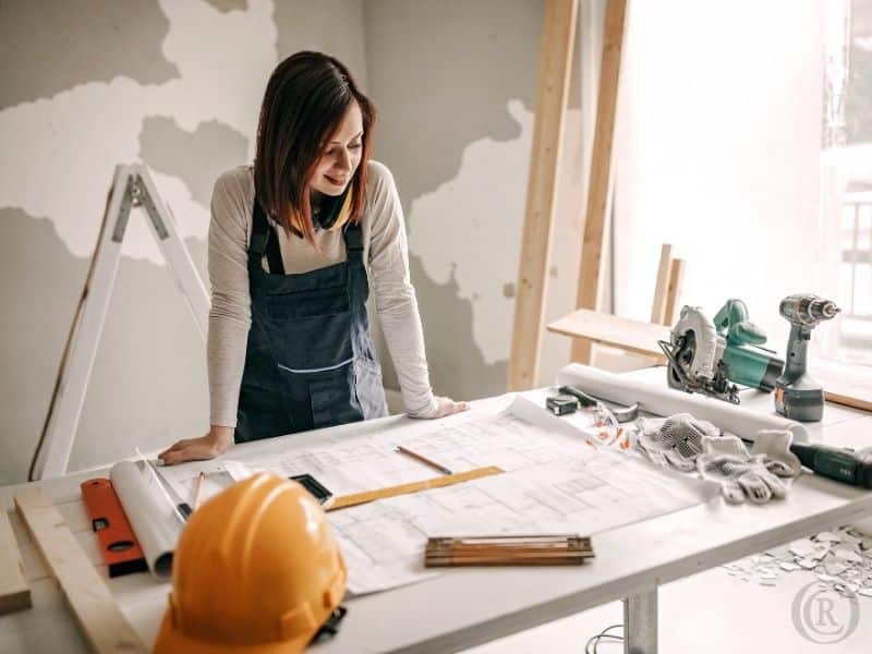A woman checking construction plans.