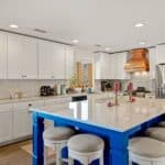 kitchen remodel with white cabinets and a blue island